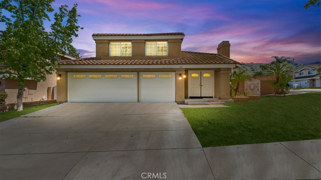 1671 Dominguez Ranch Road Corona, CA 92878 - Photo 1 of 42 This well-maintained home features a spacious three-car garage, a wide driveway, and mature landscaping that enhances its curb appeal. A tiled roof and clean stucco finish create a timeless exterior.