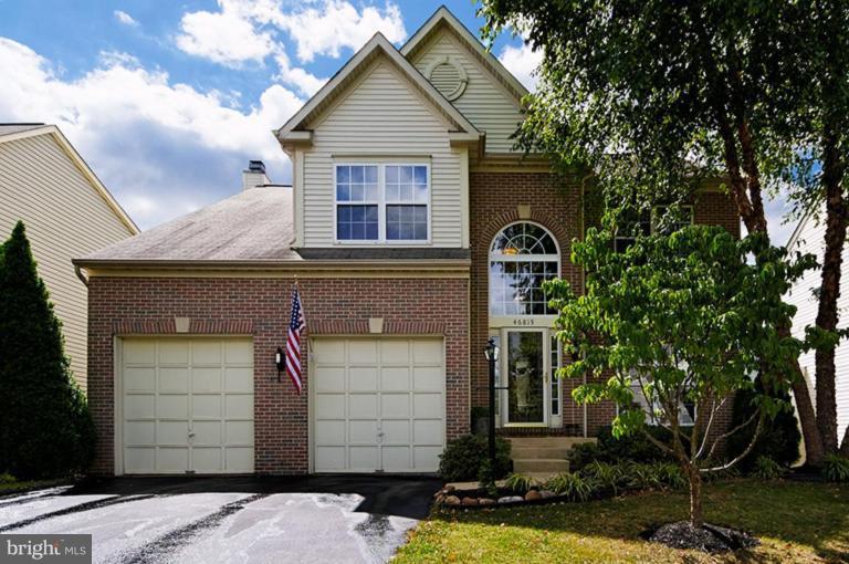 46815 Willowood Place Sterling, VA 20165 - Photo 1 of 22 a front view of a house with a yard