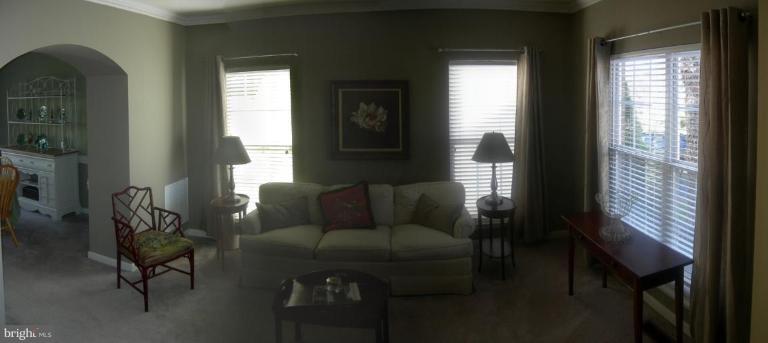 46815 Willowood Place Sterling, VA 20165 - Photo 13 of 22 a living room with furniture and a window