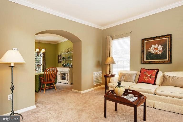 46815 Willowood Place Sterling, VA 20165 - Photo 21 of 22 a living room with furniture and a lamp