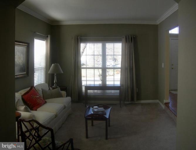 46815 Willowood Place Sterling, VA 20165 - Photo 4 of 22 a living room with furniture and a window