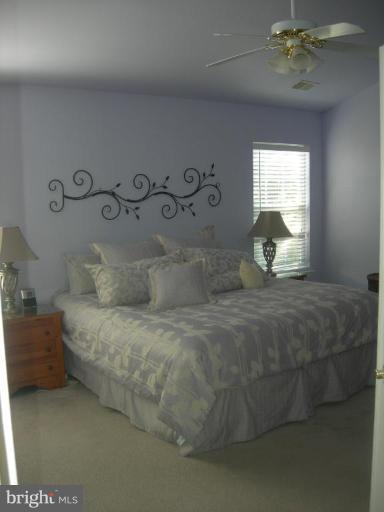 46815 Willowood Place Sterling, VA 20165 - Photo 5 of 22 a bedroom with a bed and a window