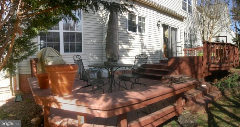 46815 Willowood Place Sterling, VA 20165 - Photo 7 of 22 a view of a chairs and table in the patio
