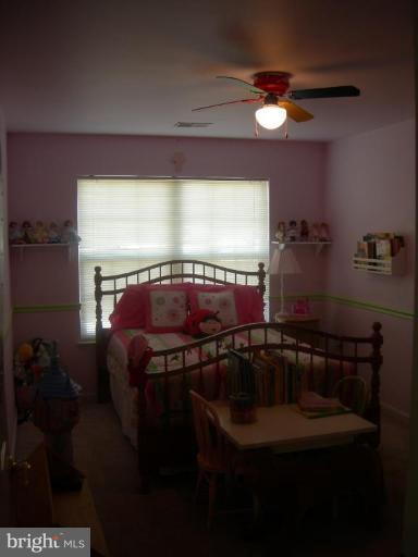 46815 Willowood Place Sterling, VA 20165 - Photo 9 of 22 a bathroom with a sink and a mirror