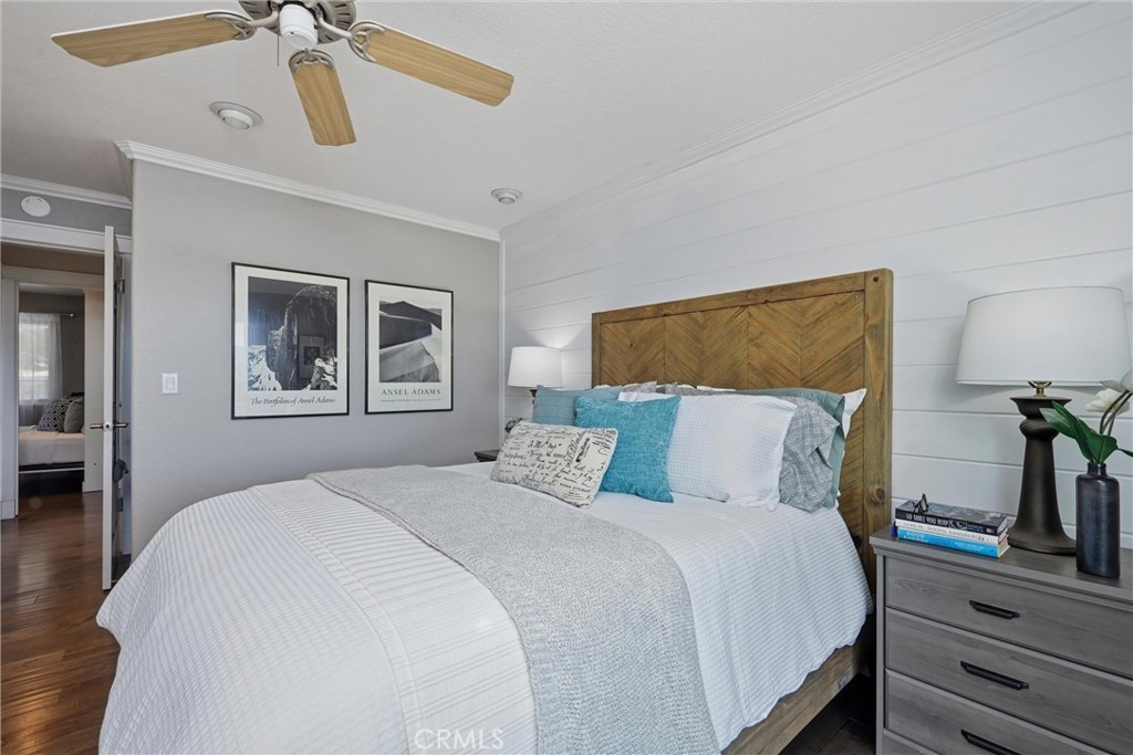 17432 Greenridge Road Hidden Valley Lake, CA 95467 - Photo 31 of 72 a bedroom with a large bed and a chandelier