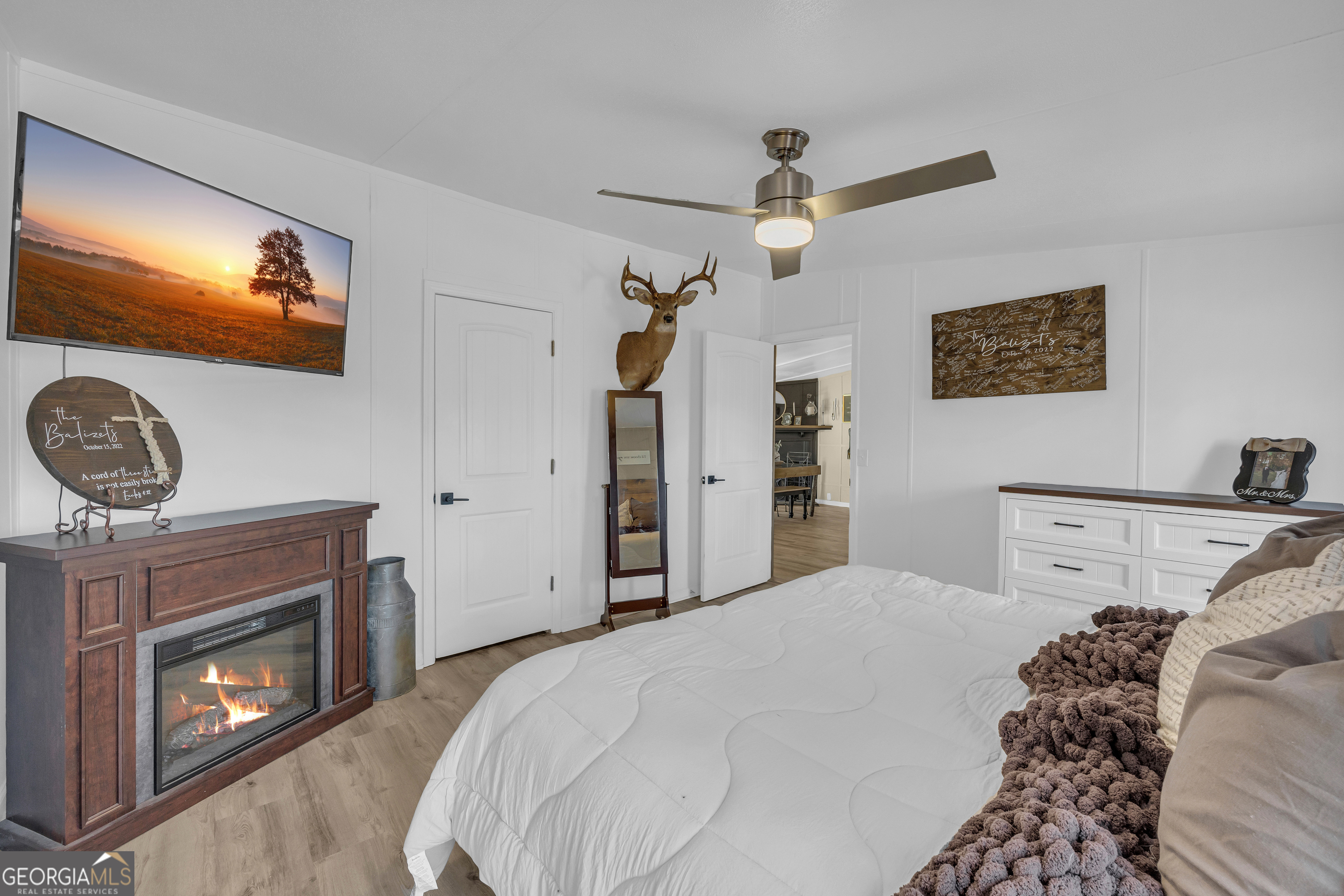 3656 Candler Road Pendergrass, GA 30567 - Photo 12 of 34 a bedroom with a bed and a fireplace