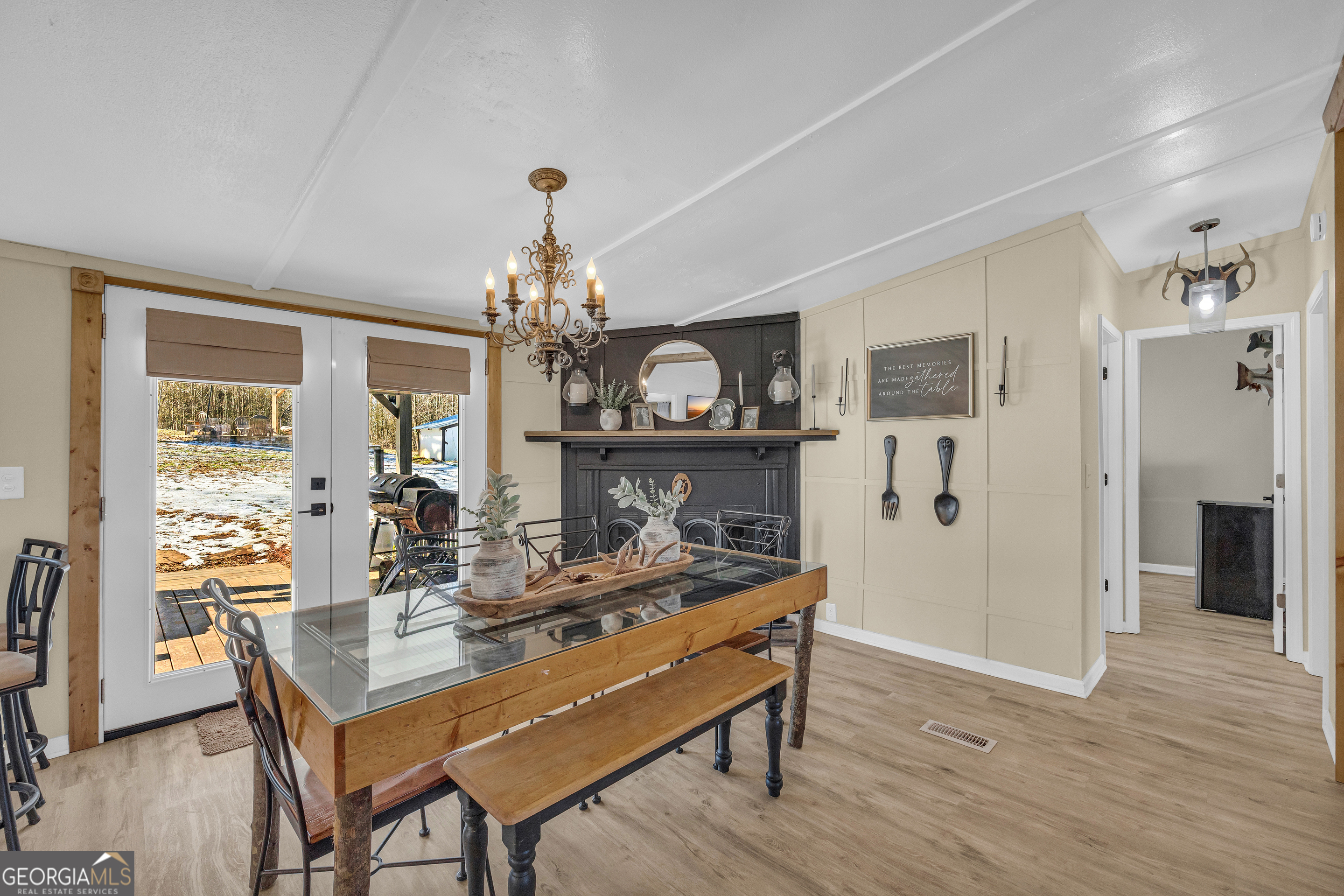 3656 Candler Road Pendergrass, GA 30567 - Photo 16 of 34 a view of a dining room with furniture and wooden floor