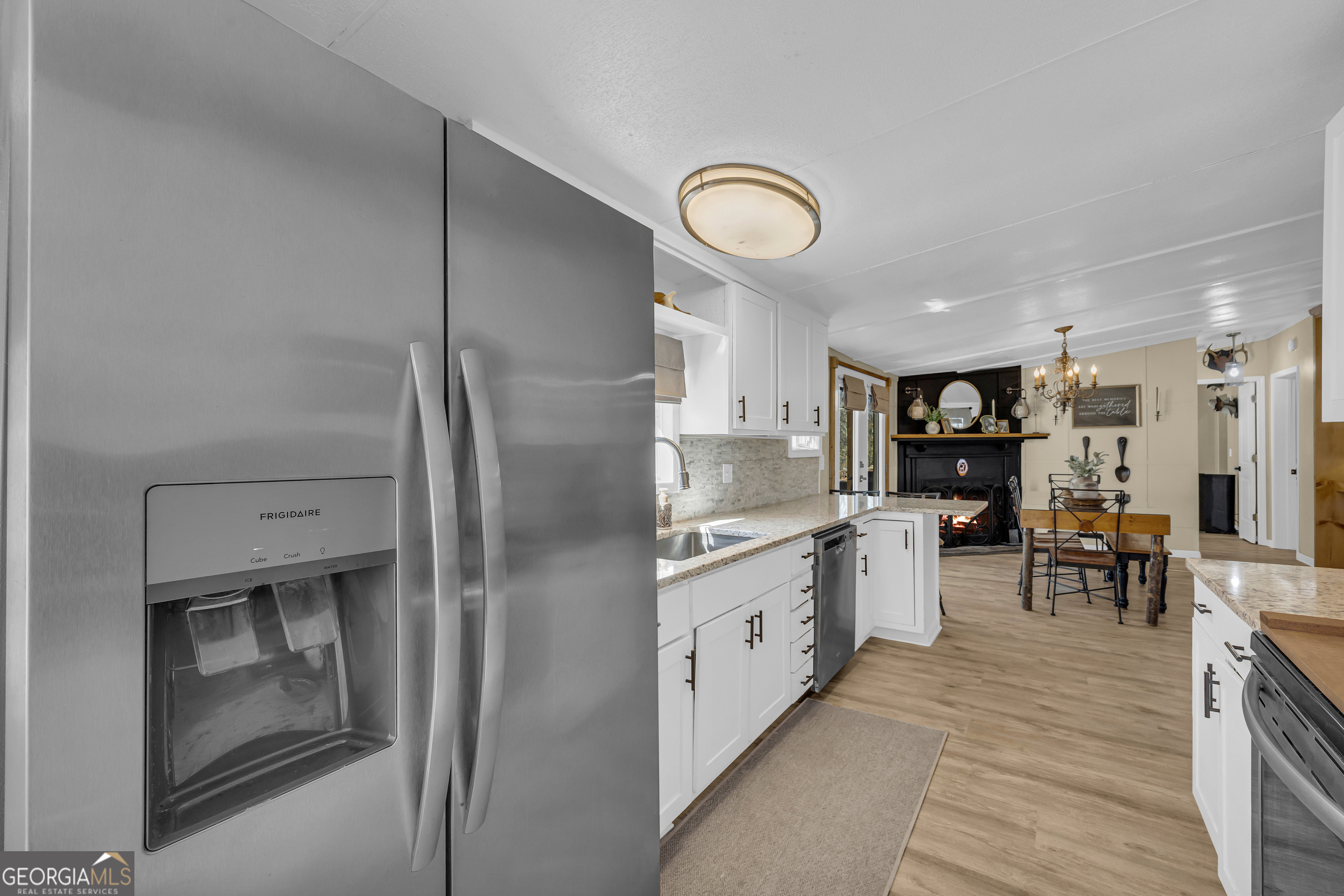 3656 Candler Road Pendergrass, GA 30567 - Photo 24 of 34 a kitchen with stainless steel appliances a refrigerator sink and stove