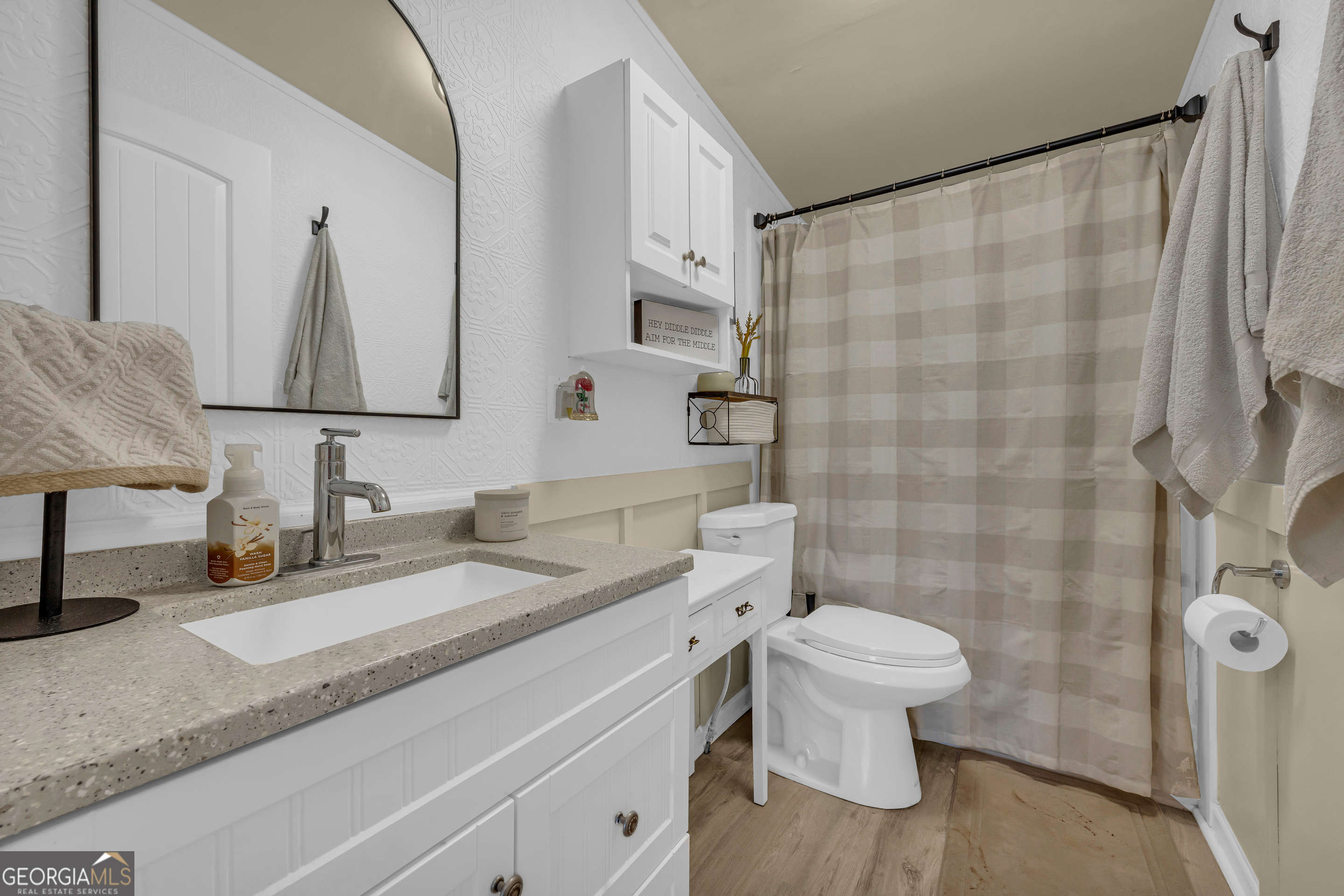 3656 Candler Road Pendergrass, GA 30567 - Photo 3 of 34 a bathroom with a granite countertop sink toilet and shower