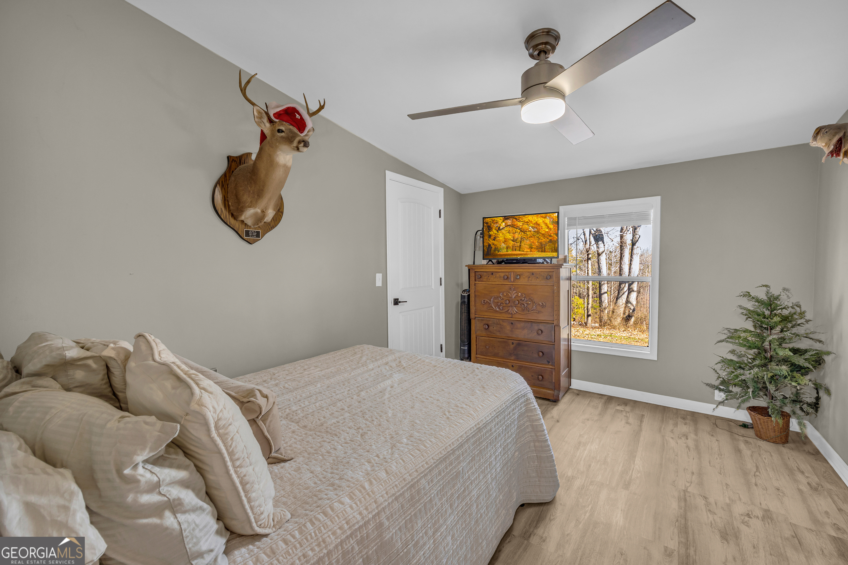 3656 Candler Road Pendergrass, GA 30567 - Photo 31 of 34 a bedroom with a bed and a window