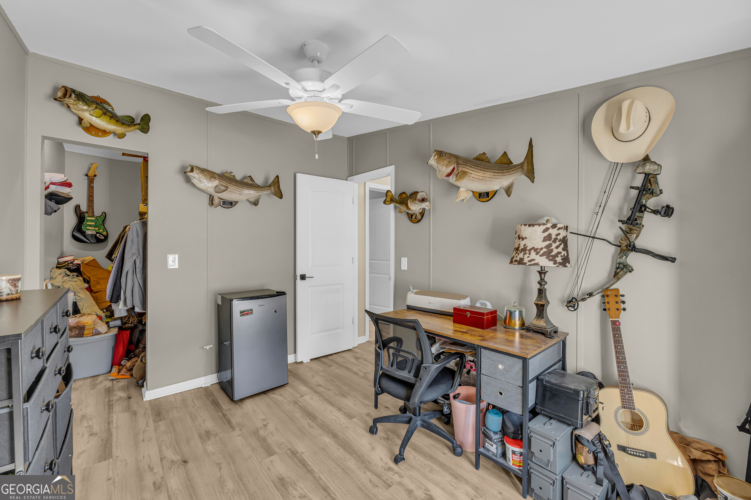 3656 Candler Road Pendergrass, GA 30567 - Photo 34 of 34 a view of a workspace with furniture and ceiling fan
