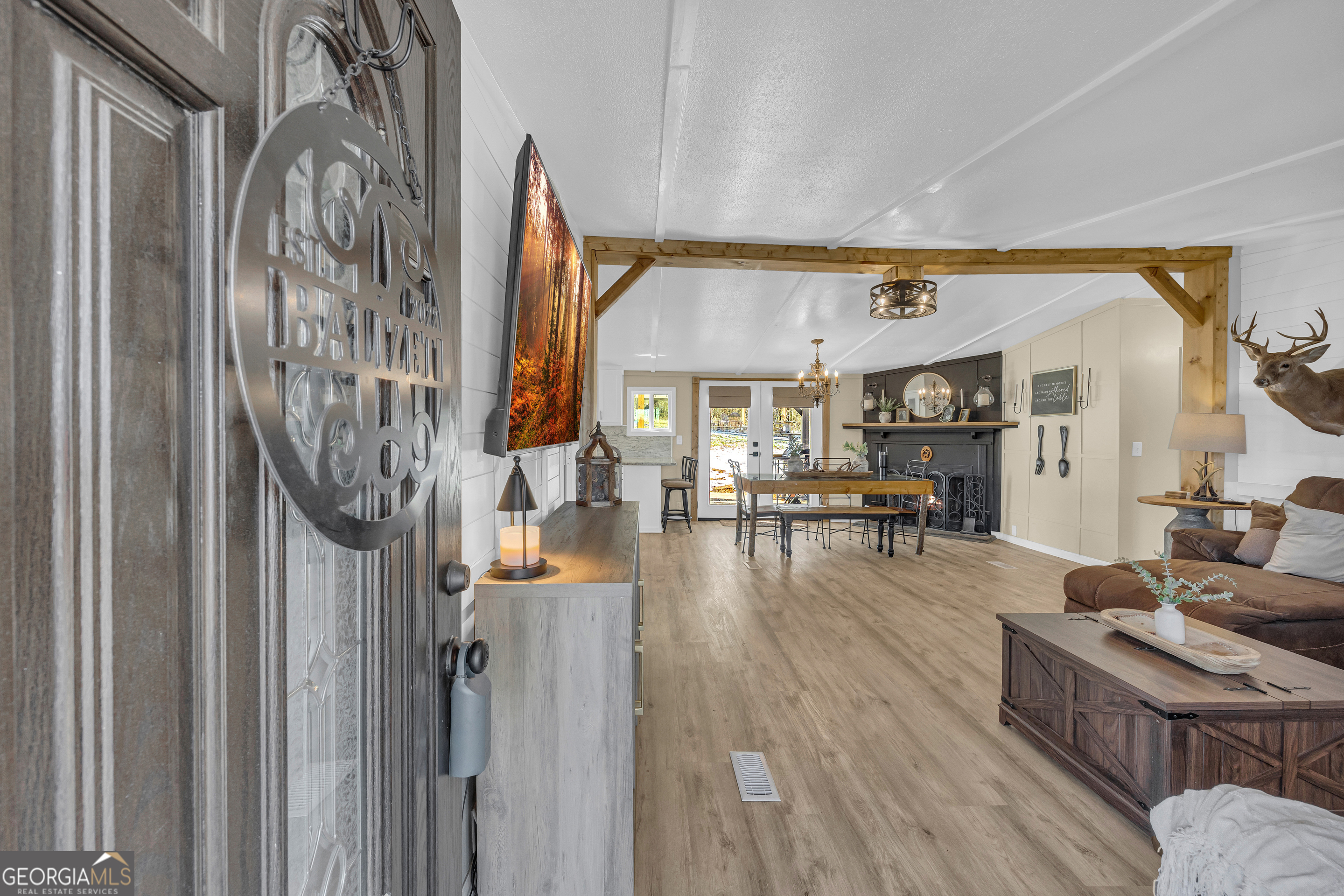 3656 Candler Road Pendergrass, GA 30567 - Photo 4 of 34 a living room with furniture and wooden floor