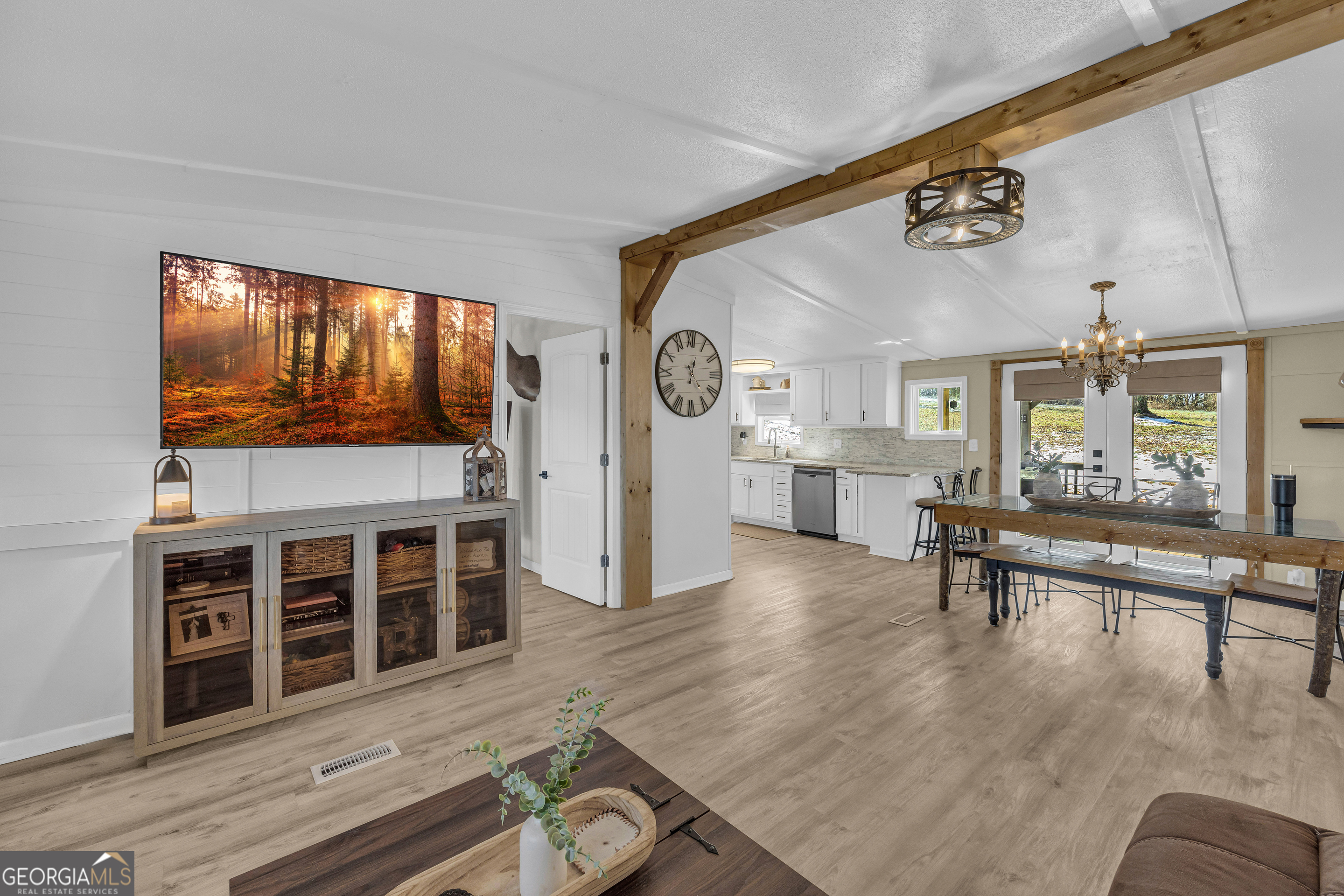 3656 Candler Road Pendergrass, GA 30567 - Photo 6 of 34 a living room with furniture and a flat screen tv