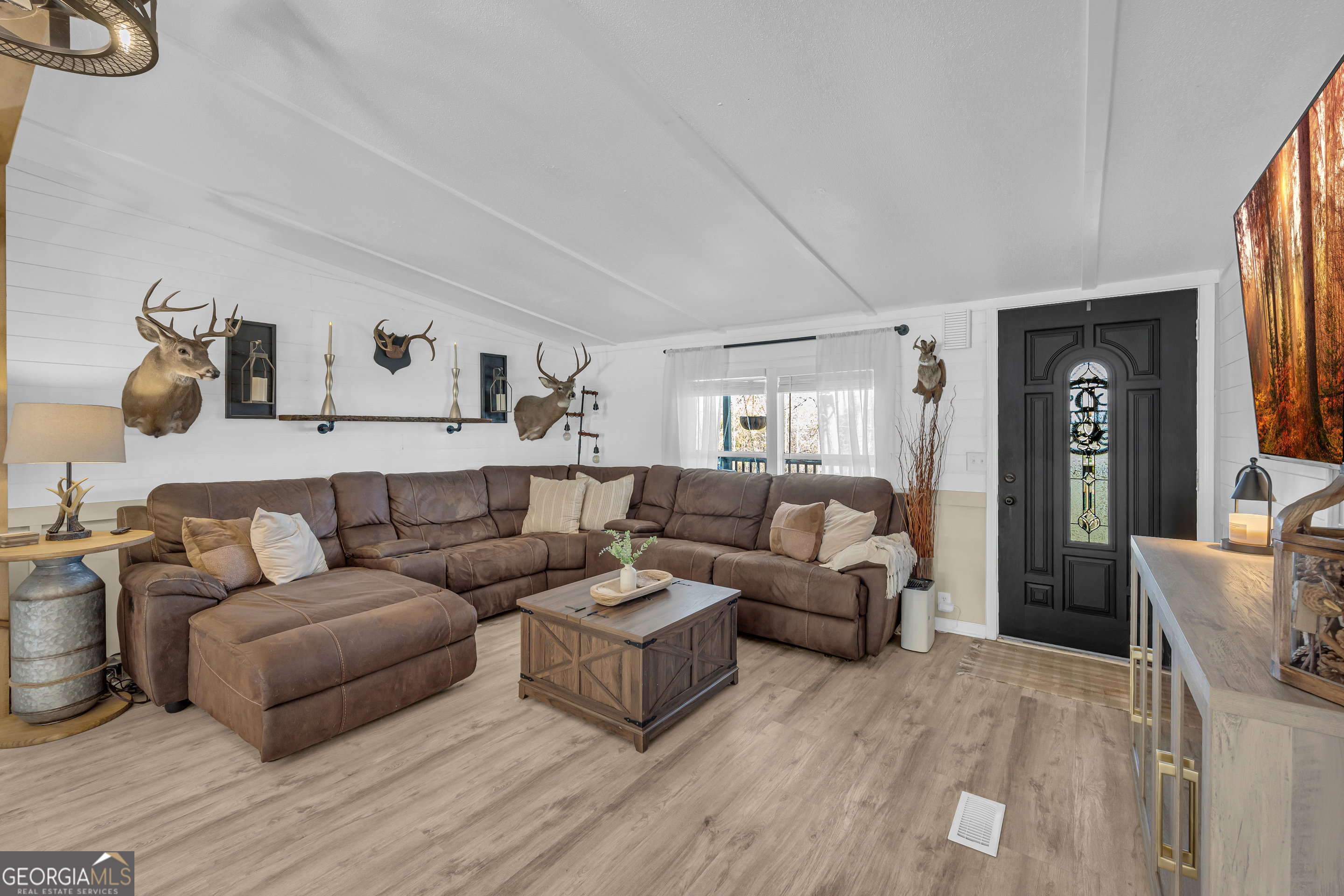 3656 Candler Road Pendergrass, GA 30567 - Photo 8 of 34 a living room with furniture and a wooden floor