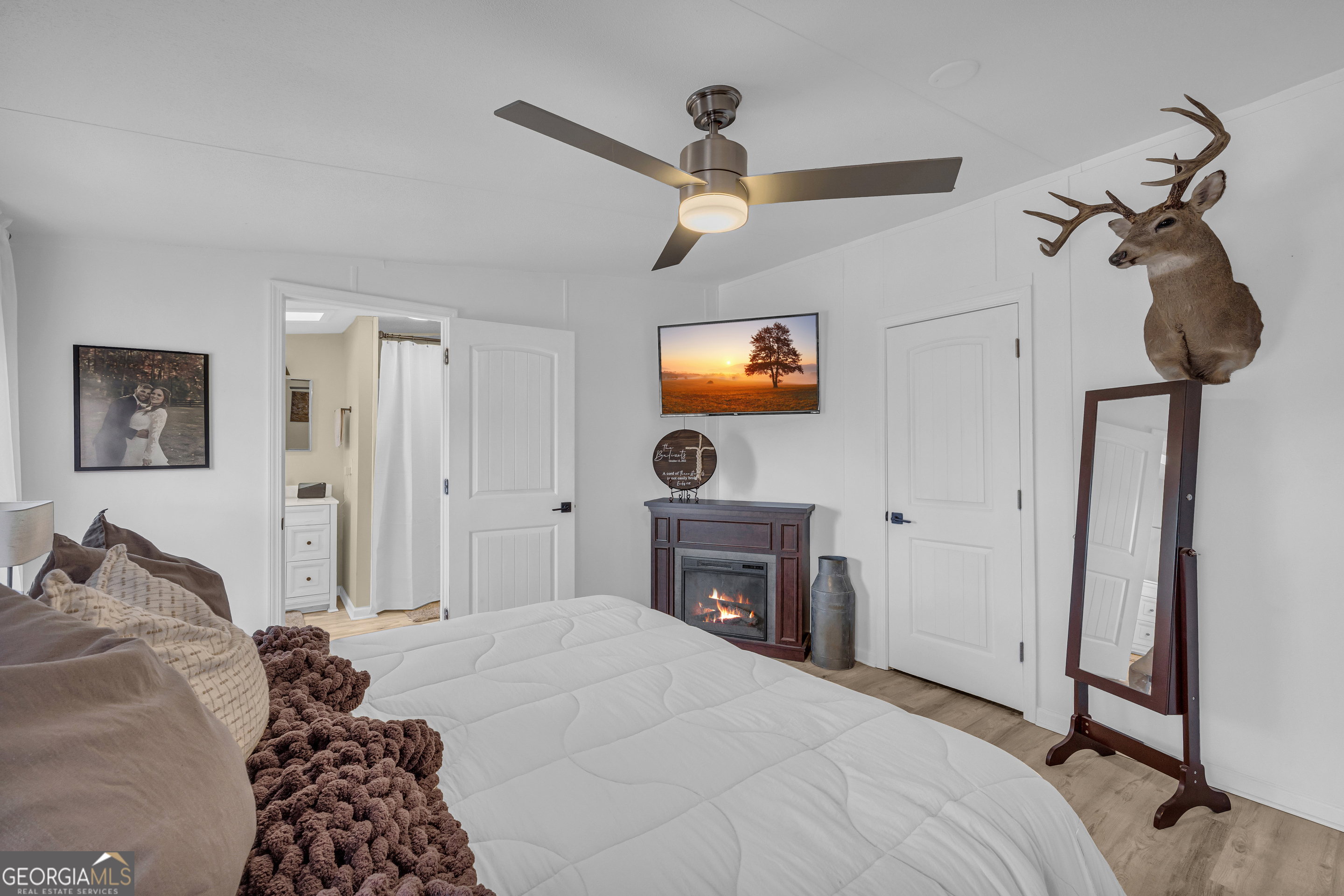 3656 Candler Road Pendergrass, GA 30567 - Photo 10 of 34 a bedroom with a bed and a tv