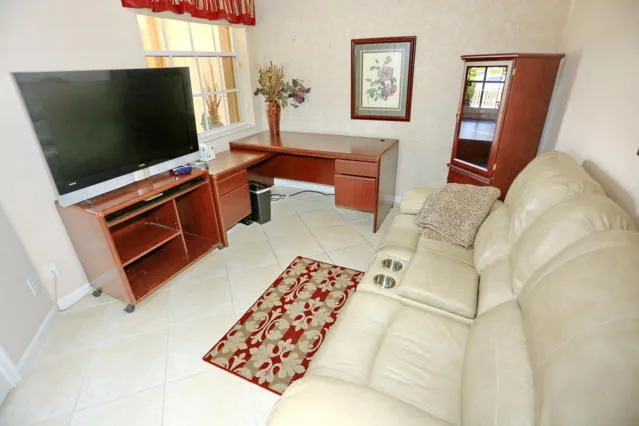 a living room with a flat screen tv and a couch