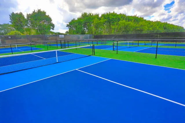 a view of an outdoor space and basketball court