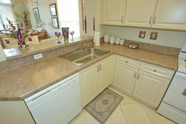 a view of a kitchen sink and dishwasher