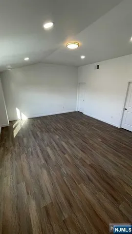 a white toilet sitting next to a bathroom sink and vanity