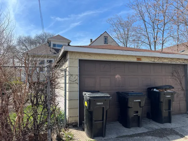 a front view of a house with parking space