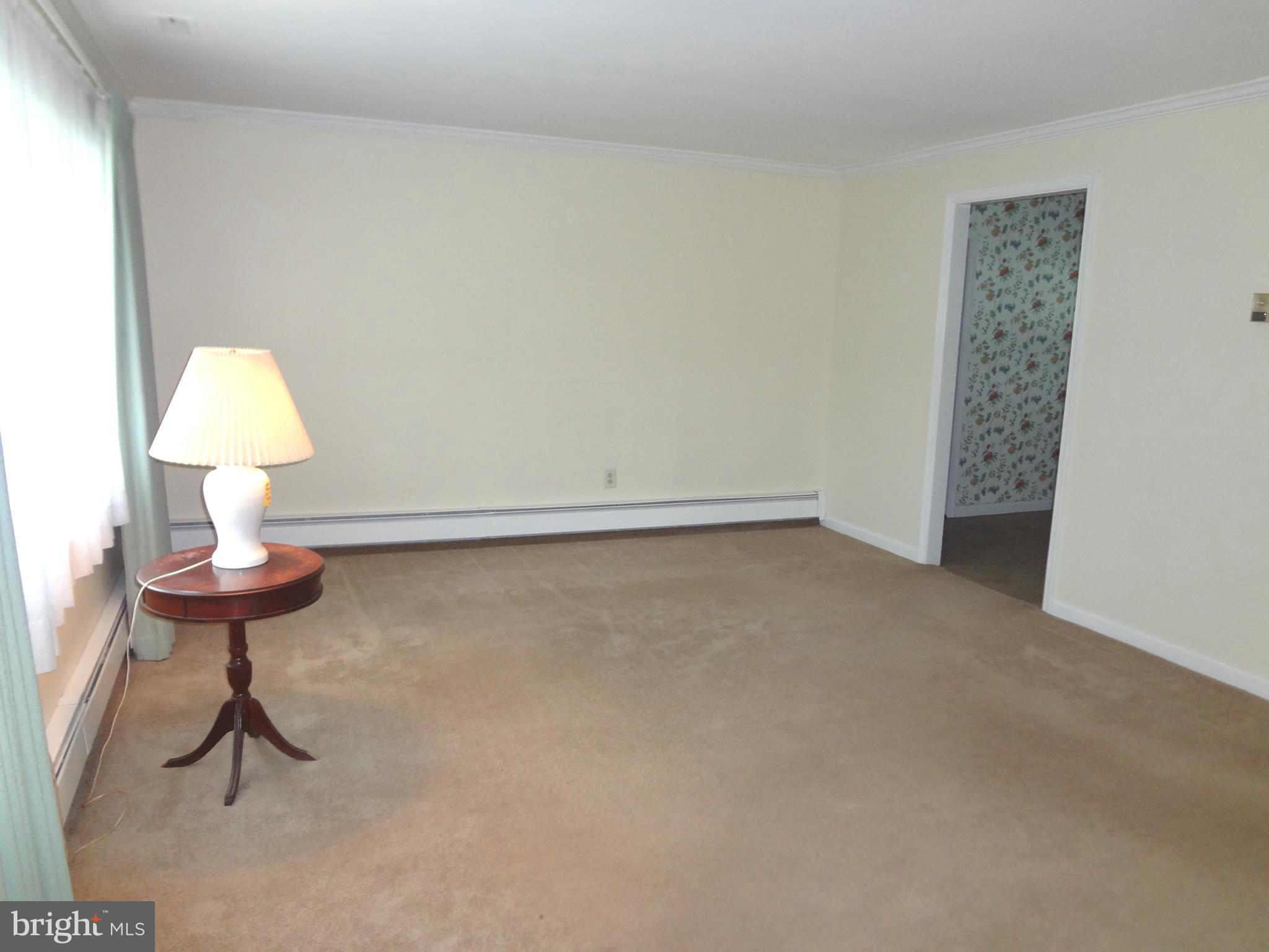 91 Cardinal Road Levittown, PA 19057 - Photo 2 of 26 a view of an empty room and a sink
