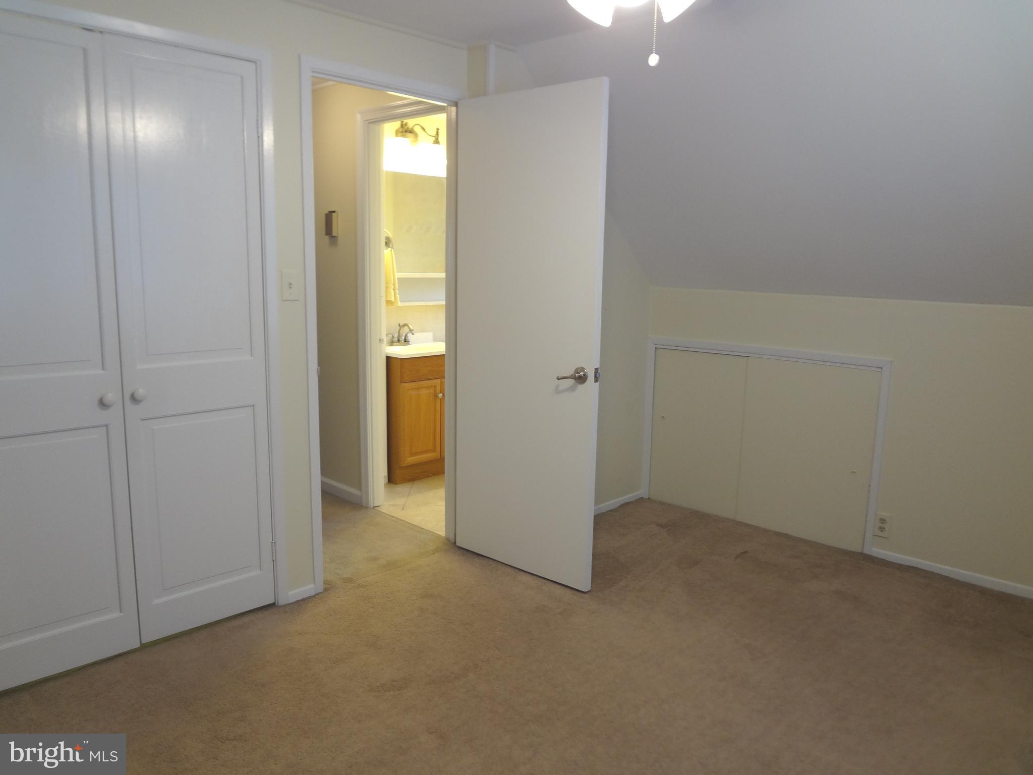 91 Cardinal Road Levittown, PA 19057 - Photo 25 of 26 an empty room with closet and mirror