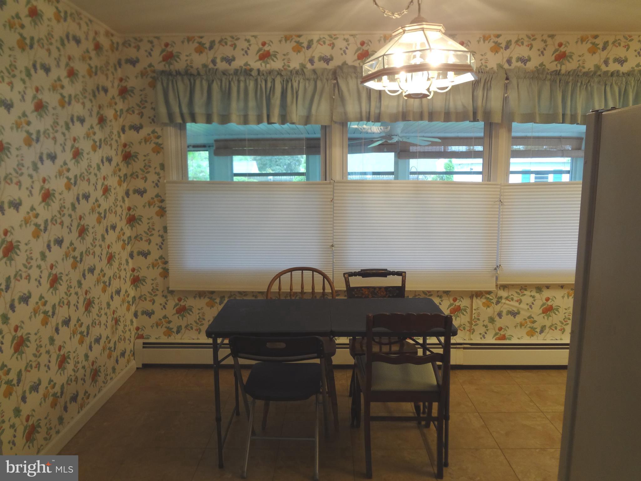91 Cardinal Road Levittown, PA 19057 - Photo 6 of 26 a table with a vase and window
