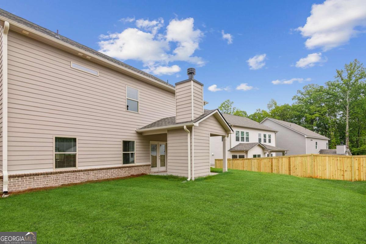 5566 Overview Drive, Unit 25 Flowery Branch, GA 30542 - Photo 19 of 20 a view of a house with a backyard