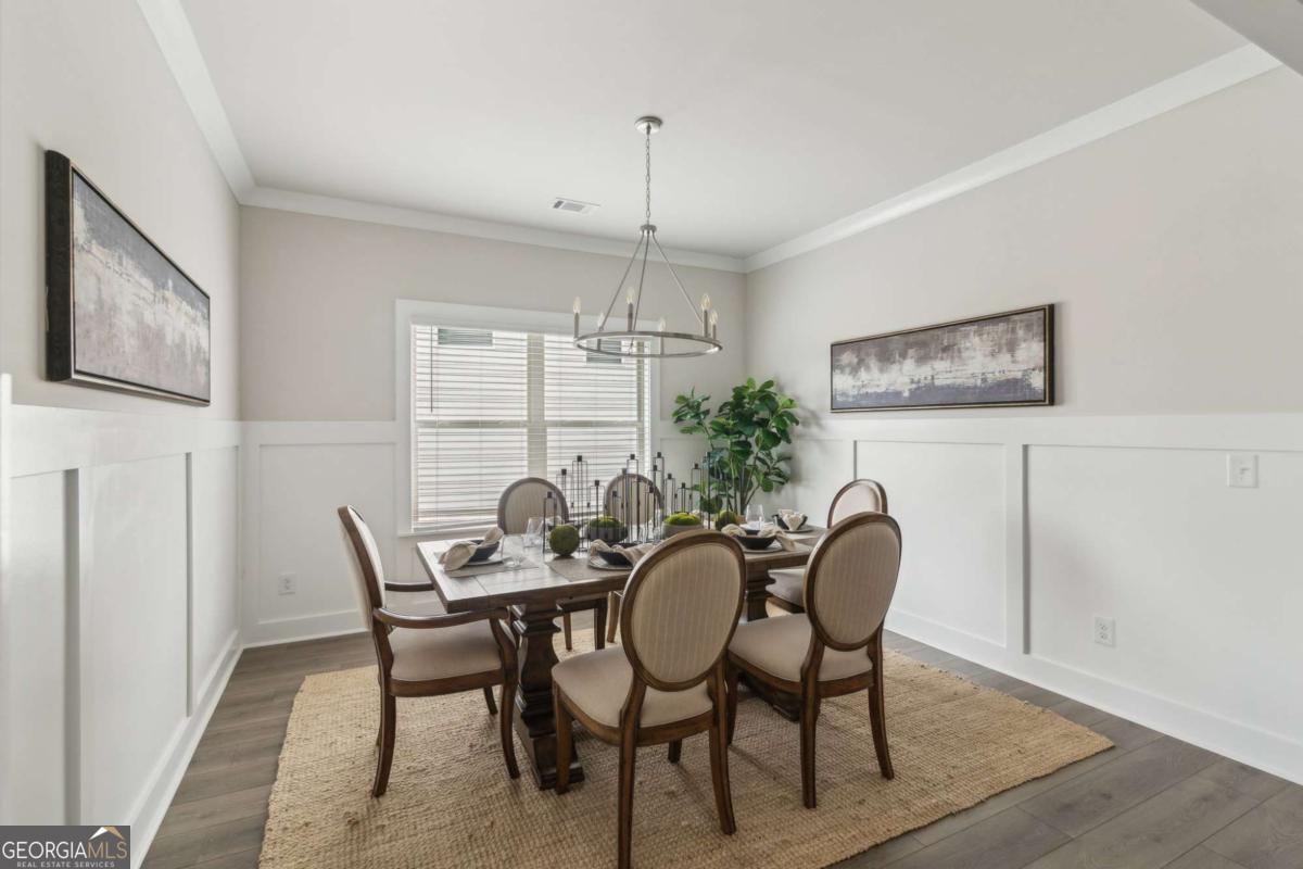 5566 Overview Drive, Unit 25 Flowery Branch, GA 30542 - Photo 3 of 20 a dining room with furniture and window