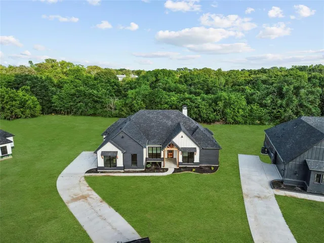 a aerial view of a house with garden