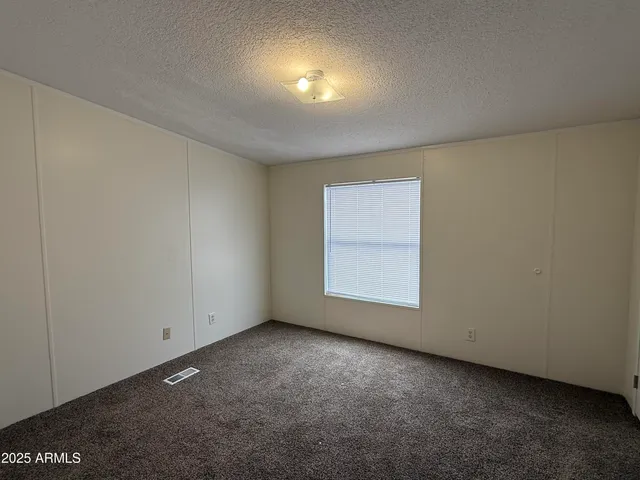 an empty room with a empty space and window