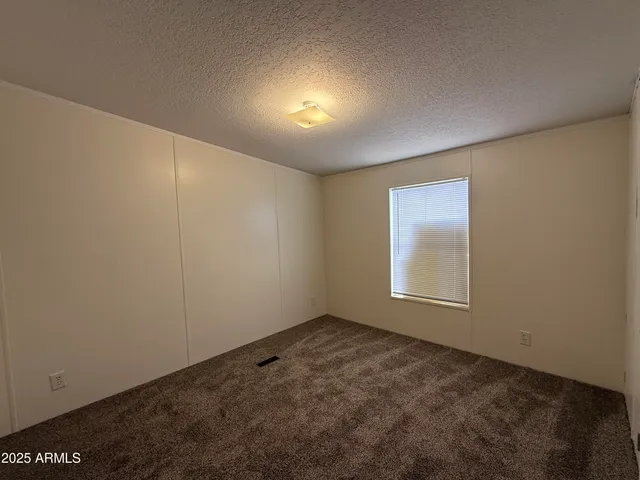 an empty room with a empty space and window