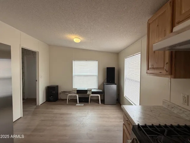 a view of a livingroom with furniture and workspace