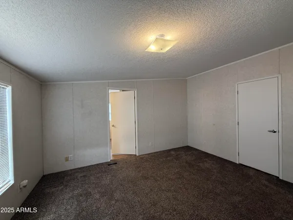 an empty room with a empty space and windows