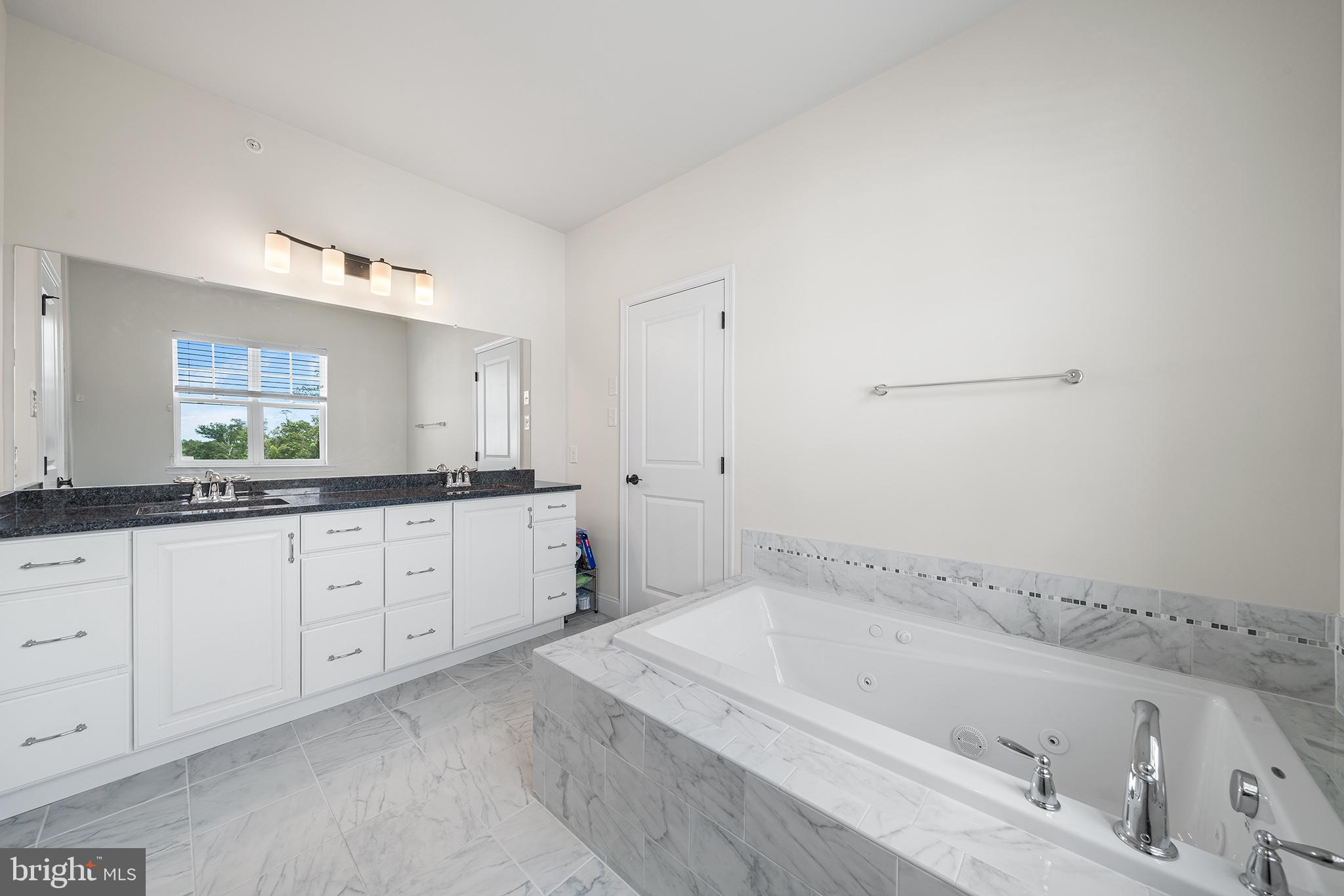 111 Park View Lane Royersford, PA 19468 - Photo 25 of 49 a spacious bathroom with a tub sink and mirror