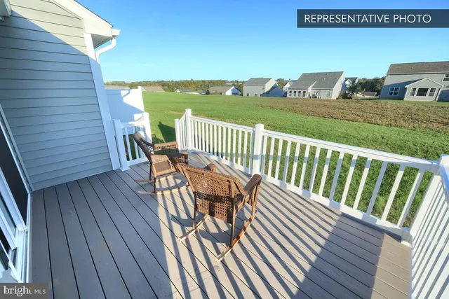 a view of balcony with deck and wooden floor