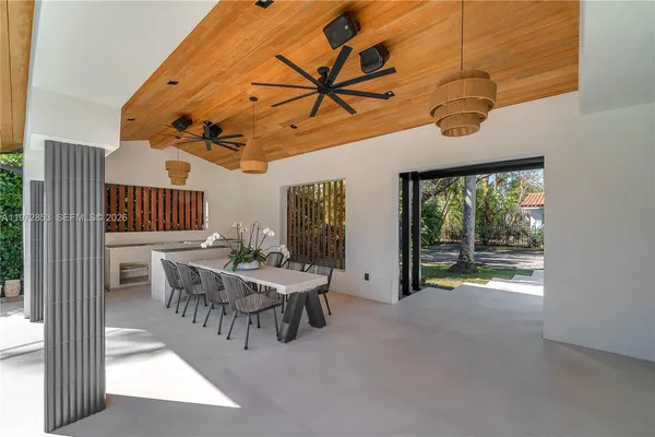 a view of a patio with a table and chairs