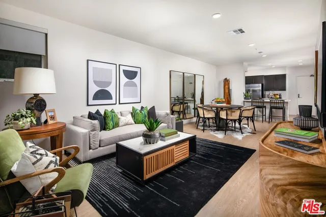 a living room with furniture fireplace and a table