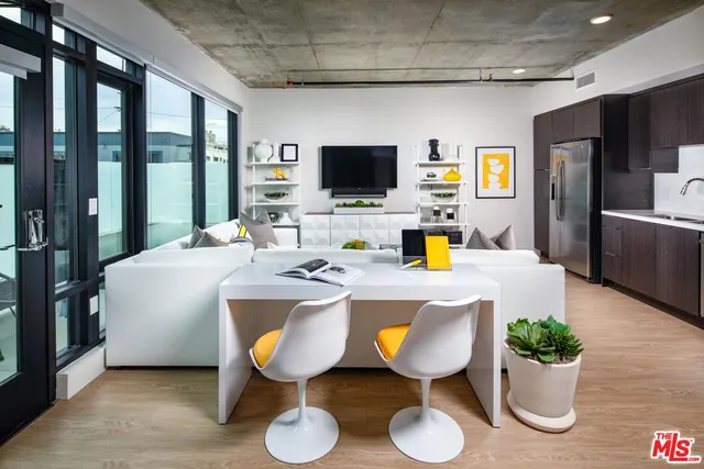 a very nice looking dining room with a table and chairs