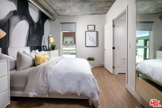 a bedroom with a bed and a couch