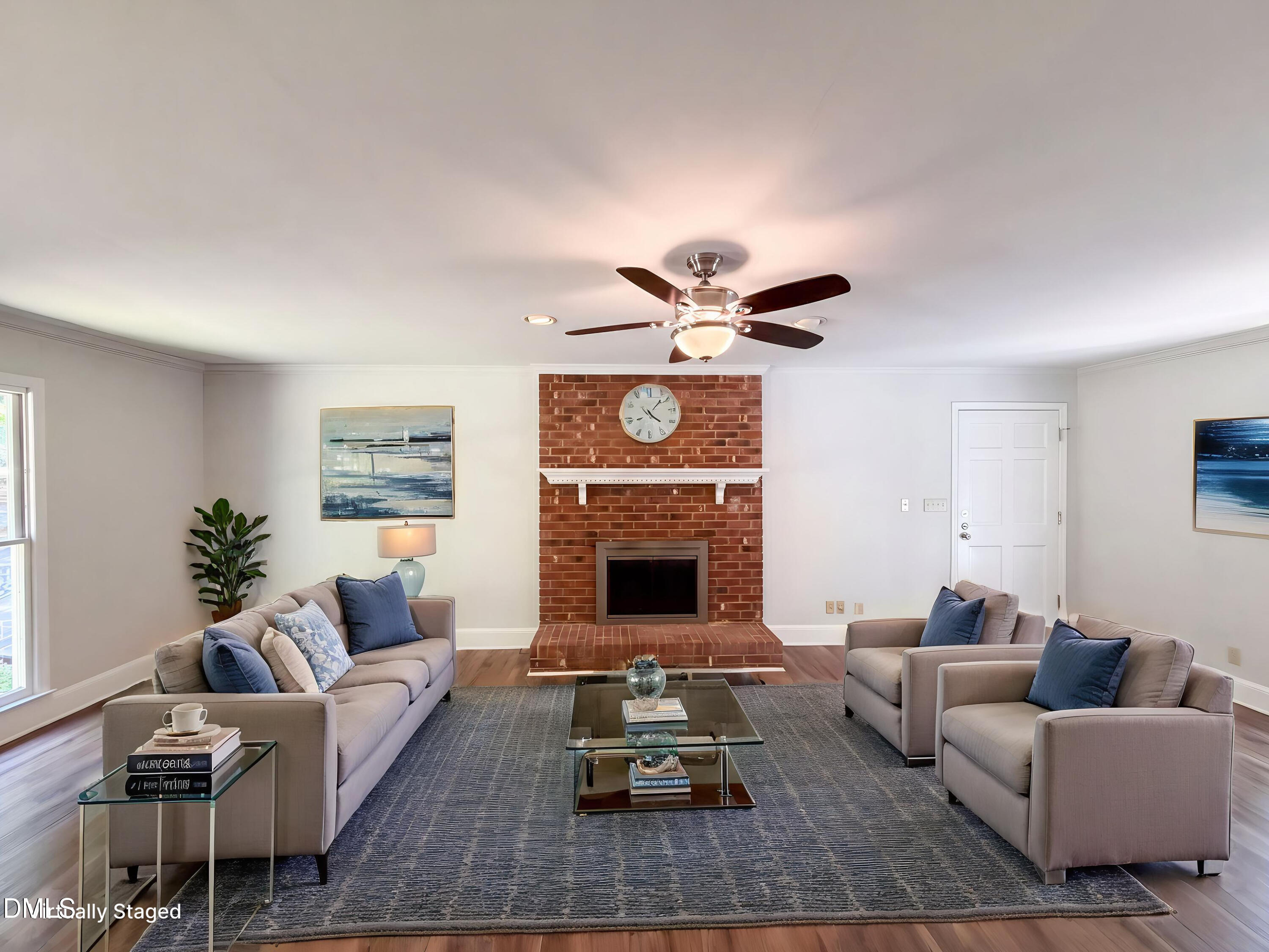 102 Lakeside Farm Road Zebulon, NC 27597 - Photo 2 of 18 a living room with furniture and a fireplace