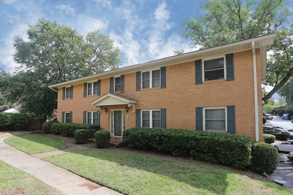 3510 Roswell Road, Unit J2 Atlanta, GA 30305 - Photo 1 of 1 a front view of a house with garden