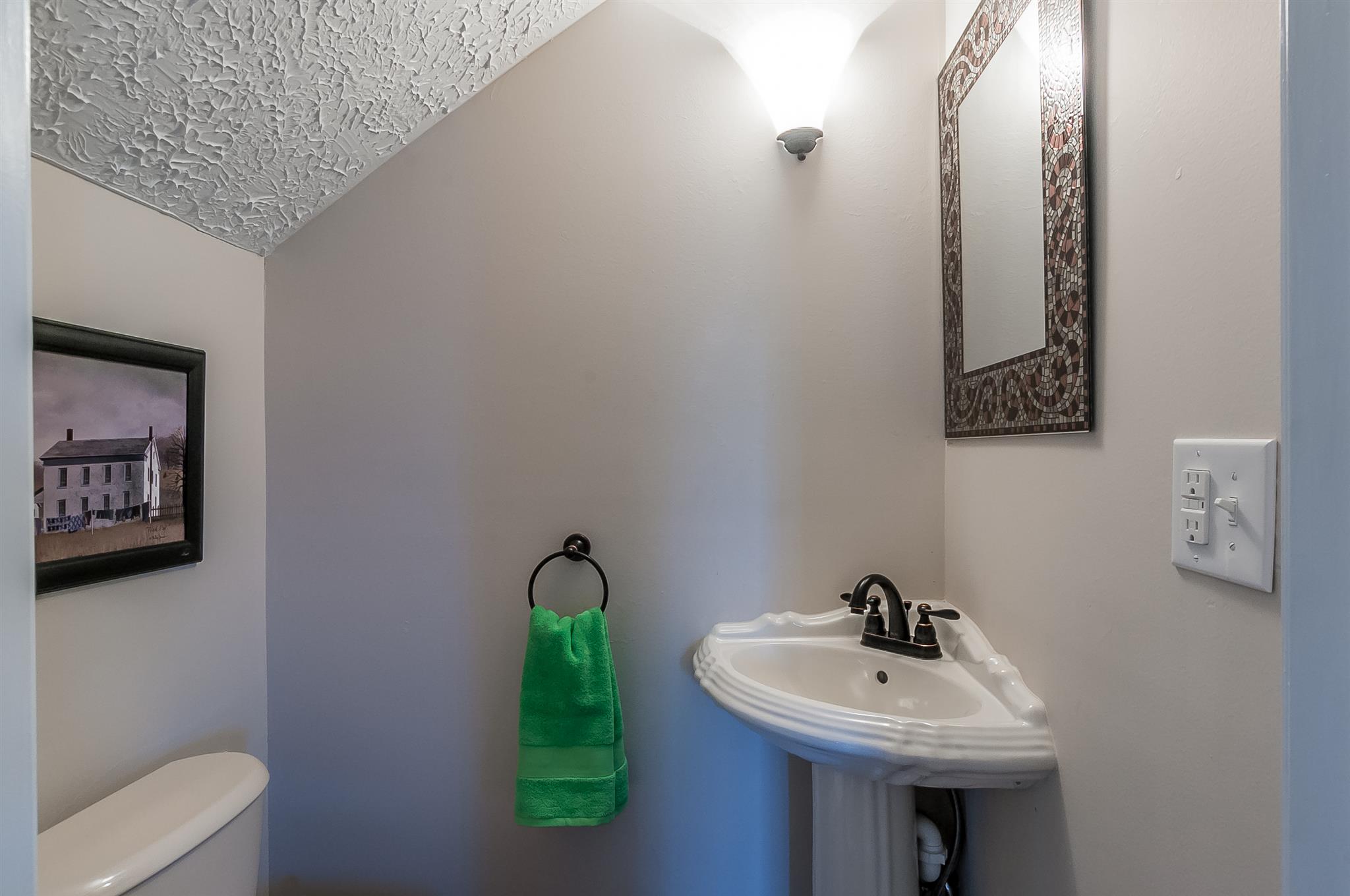 845 Roberts Road Watertown, TN 37184 - Photo 21 of 30 a bathroom with a sink and a mirror