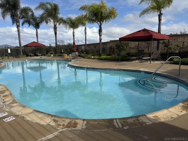 a view of swimming pool with outdoor seating
