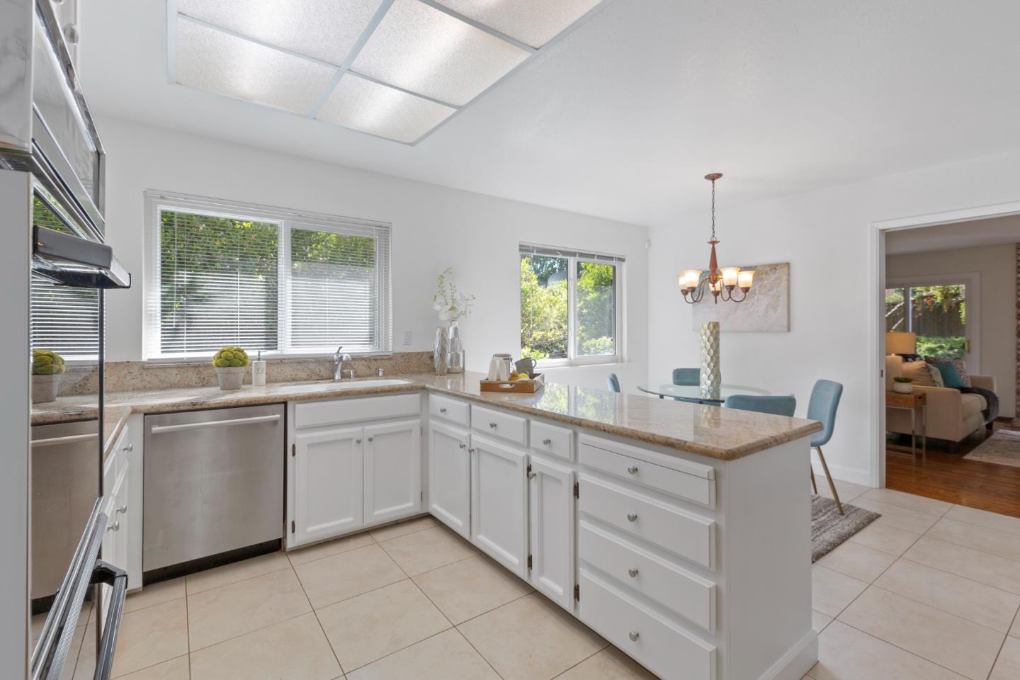 244 Delphi Circle Los Altos, CA 94022 - Photo 14 of 61 a kitchen with a sink and cabinets