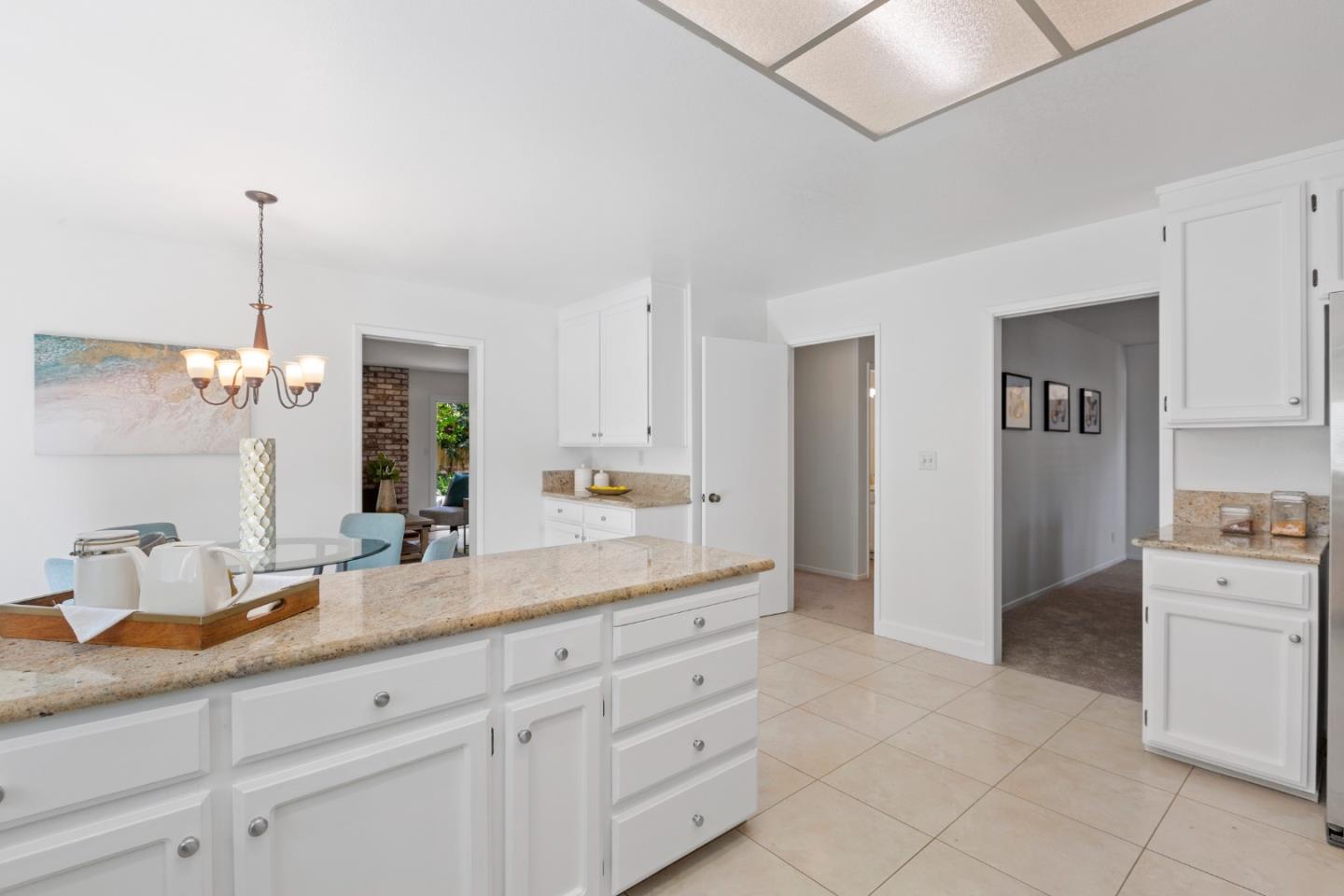 244 Delphi Circle Los Altos, CA 94022 - Photo 16 of 61 a spacious en suite bathroom with a granite countertop sink and a mirror