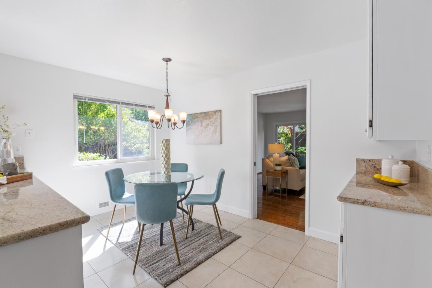 244 Delphi Circle Los Altos, CA 94022 - Photo 17 of 61 a dining room with furniture a chandelier and a rug
