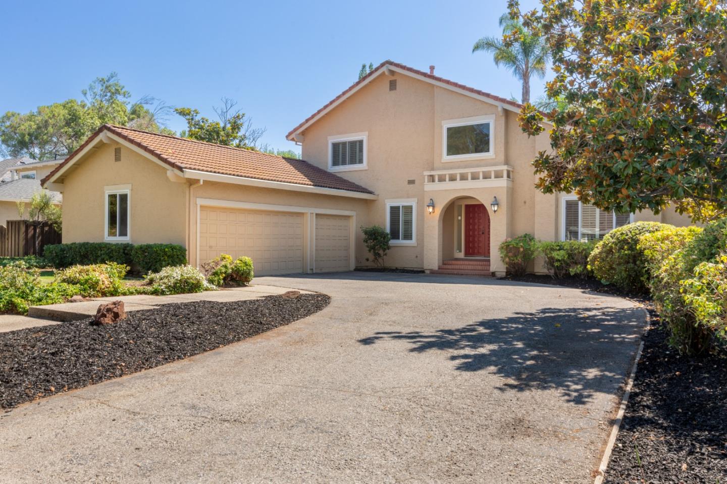 244 Delphi Circle Los Altos, CA 94022 - Photo 2 of 61 a front view of a house with a yard and garage