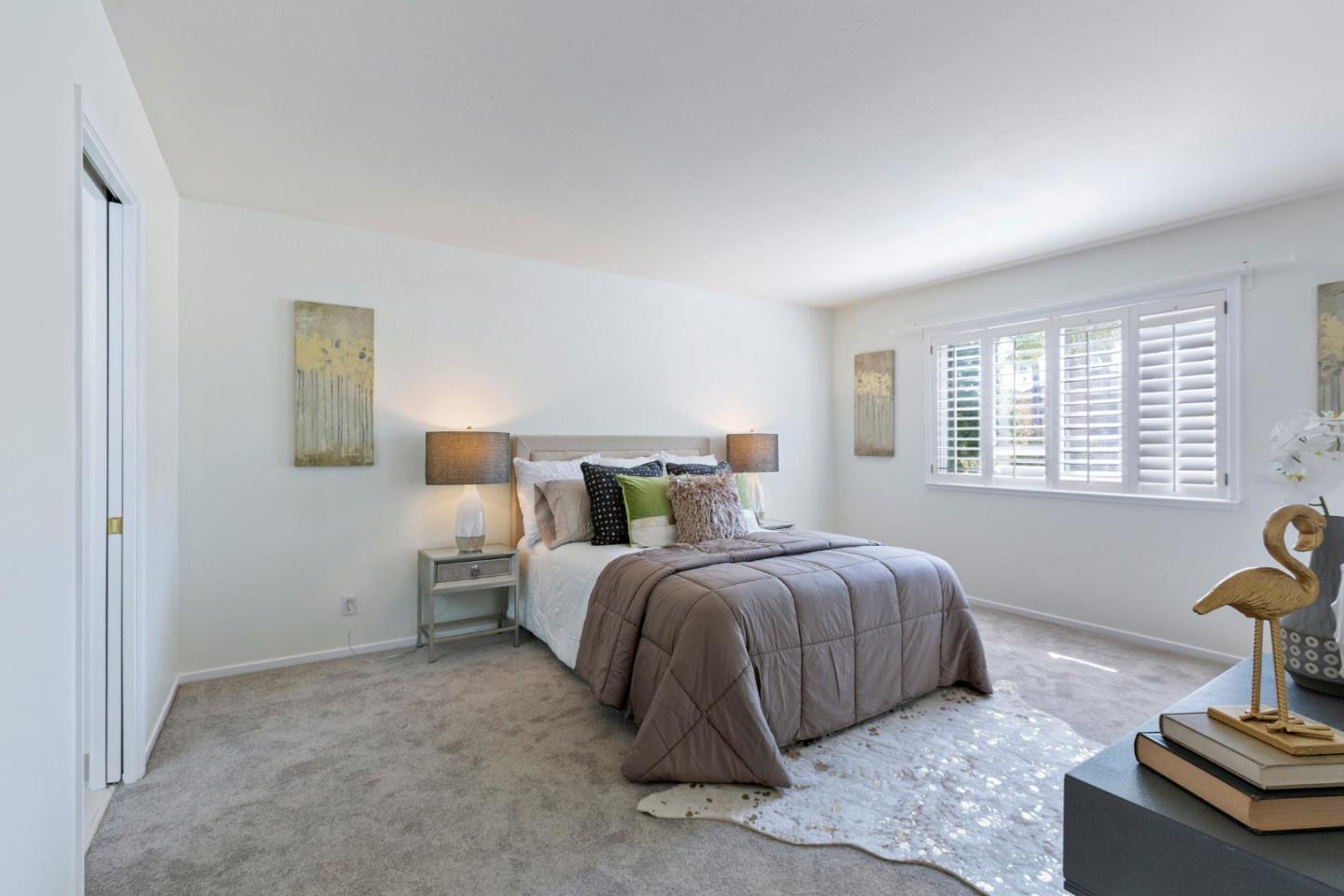 244 Delphi Circle Los Altos, CA 94022 - Photo 33 of 61 a spacious bedroom with a bed and window