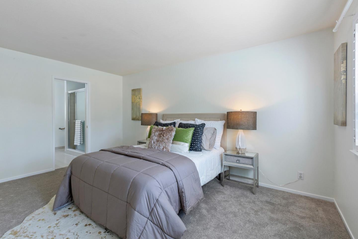 244 Delphi Circle Los Altos, CA 94022 - Photo 34 of 61 a bedroom with a bed and a lamp